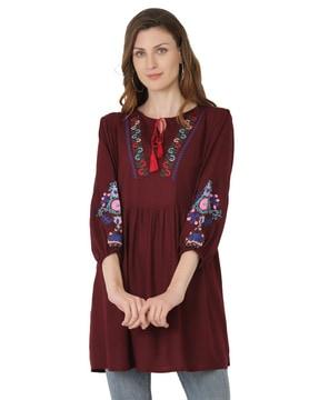 flared tunic with embroidery