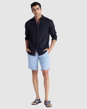 flat-front bermudas with flap pockets