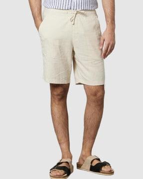 flat-front bermudas with flap pockets