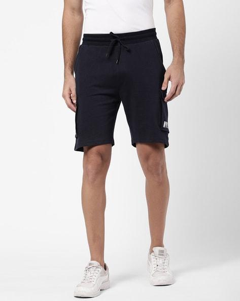 flat-front knit shorts with patch pockets