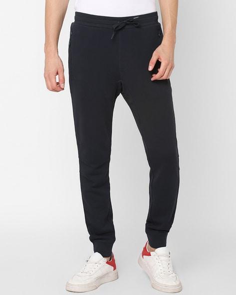 flat-front cuffed pants with zipper pockets