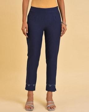 flat-front pants with placement embroidery