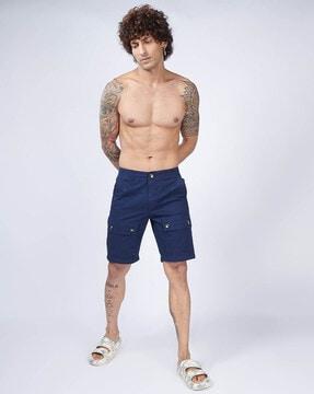 flat-front shorts with flap pockets