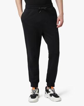 fleece lined trackpants with eagle logo