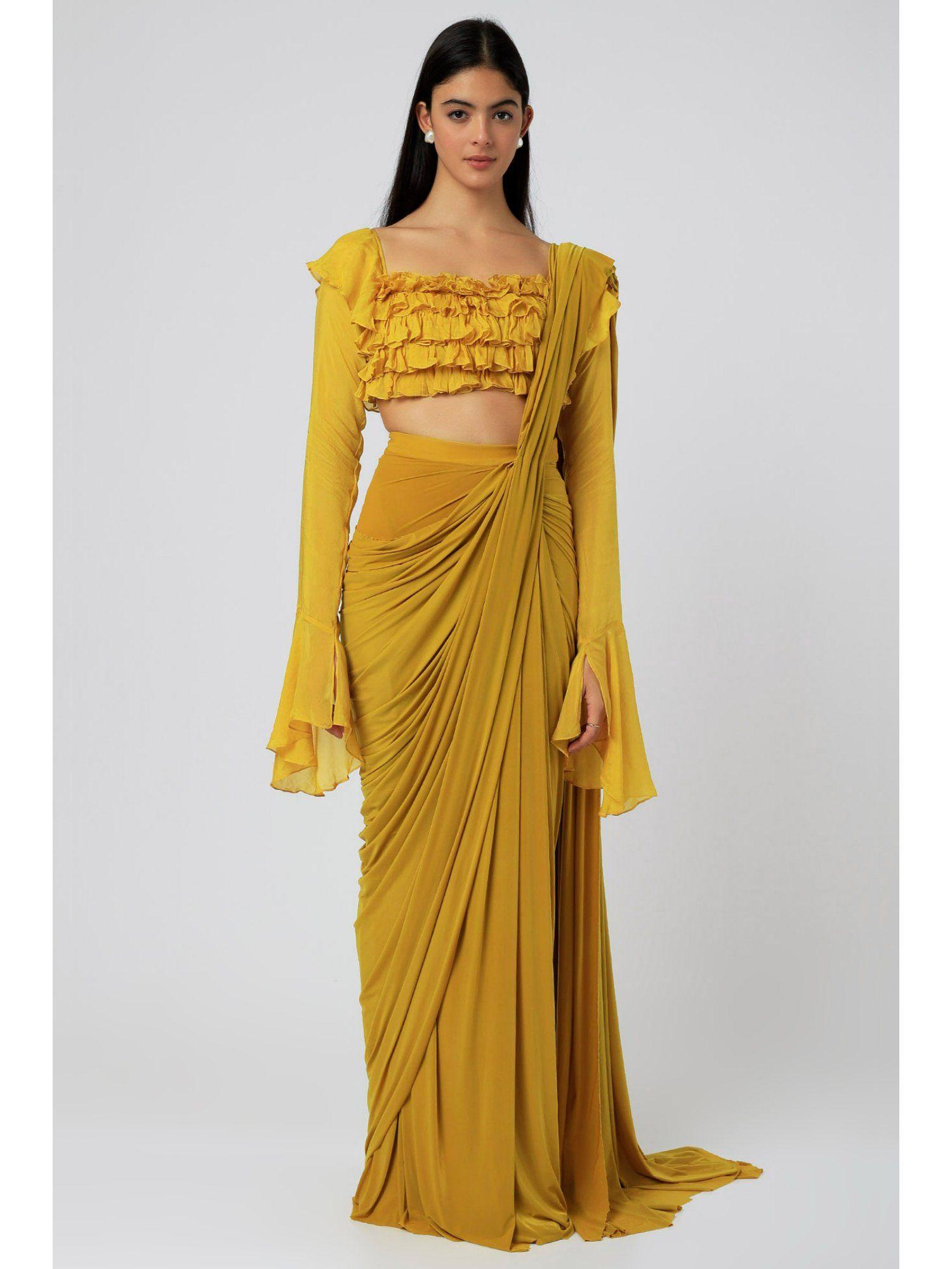 fleur yellow ruffle saree with stchied blouse