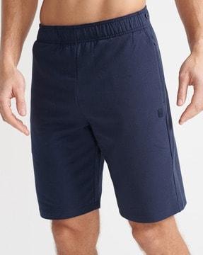 flex bermuda shorts with zipper pockets