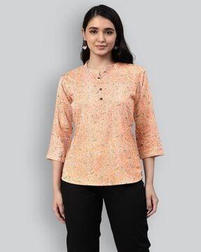 floral print top with half-button closure
