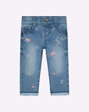 floral embroidered mid-wash jeans