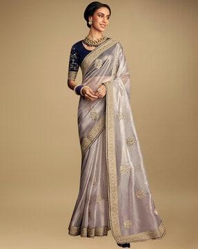 floral embroidered silk saree with tassels