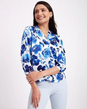 floral print top with curved hem