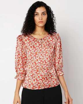 floral print top with ruffle trim