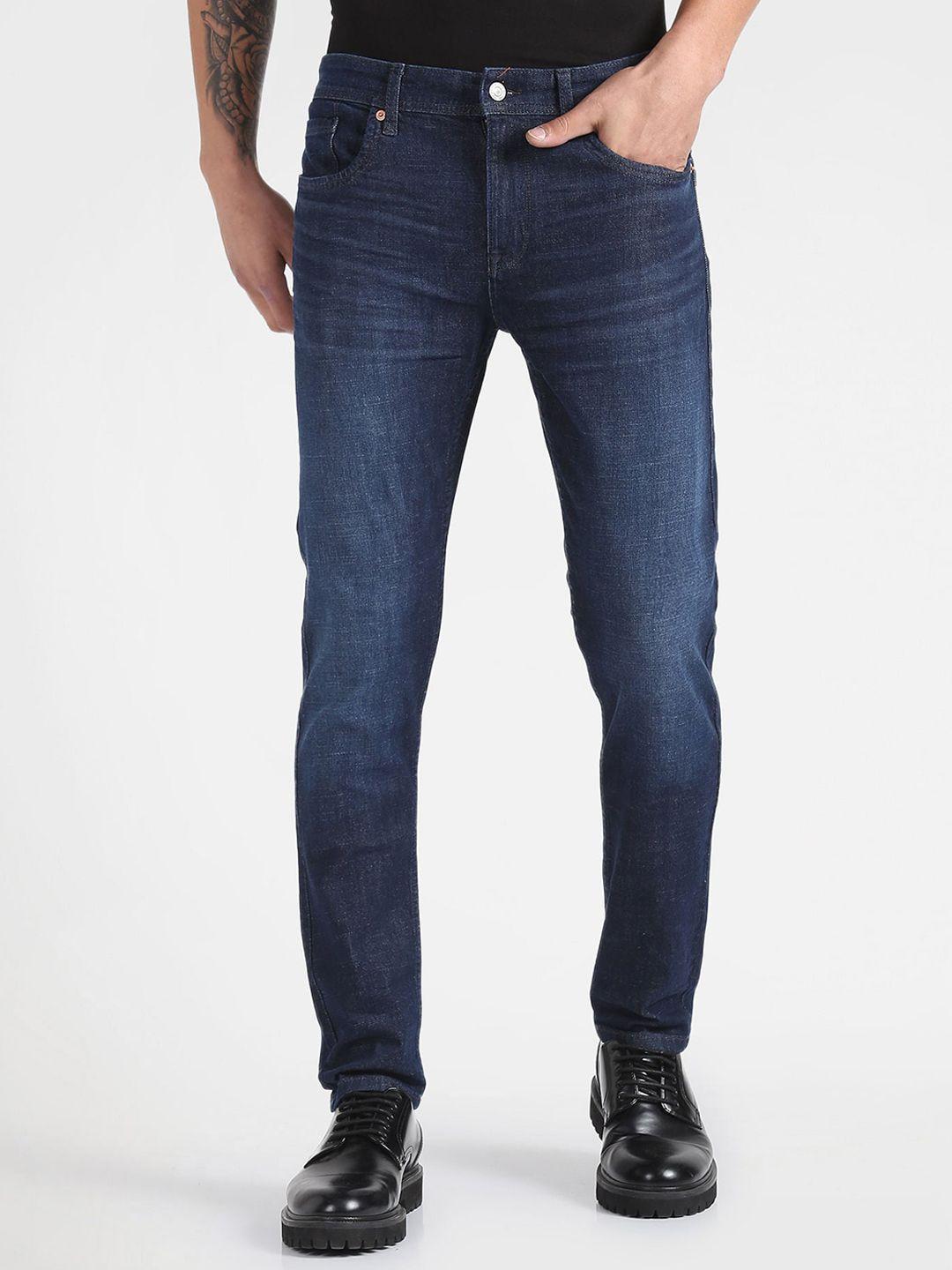 flying machine men tapered fit light fade clean look stretchable jeans