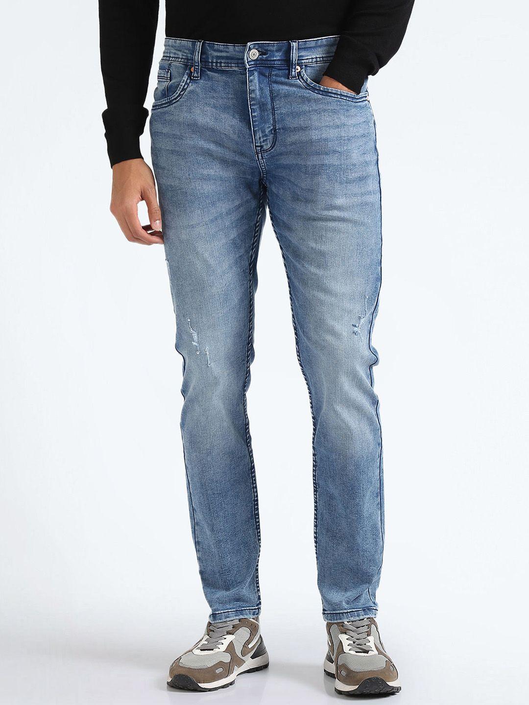 flying machine men tapered fit mid-rise low distress heavy fade stretchable jeans