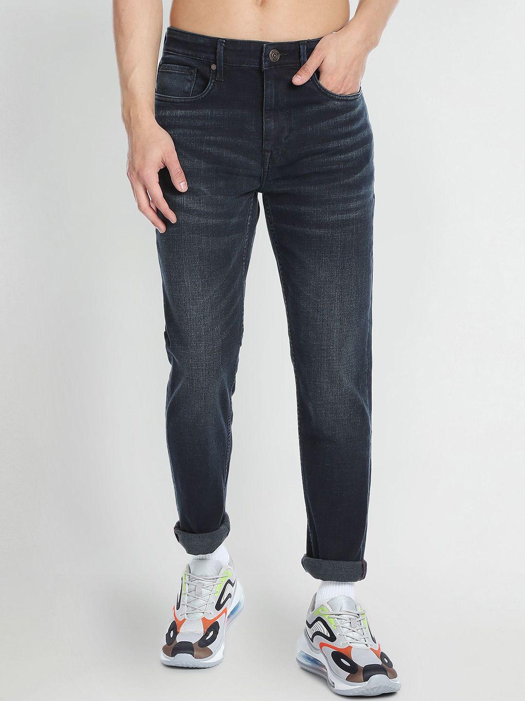flying machine men tapered fit mid-rise stretchable jeans