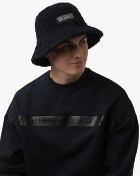 fur bucket hat with logo patch