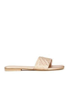 geometric embossed slip-on flat sandals