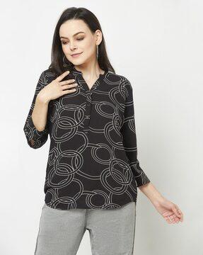 geometric print top with curved hem