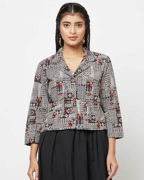 geometric print top with notched lapel