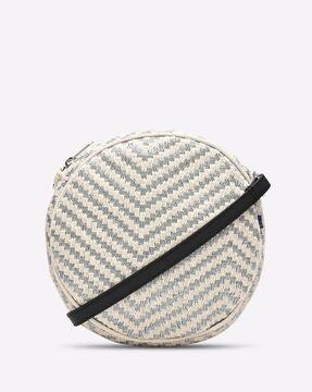 geometric woven sling bag with zip closure