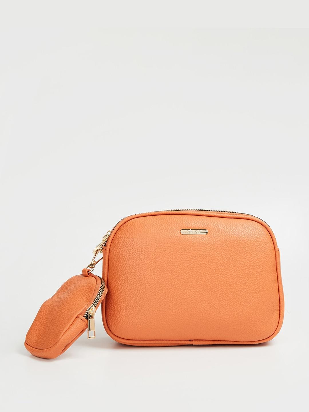 ginger by lifestyle textured zip detail sling bag