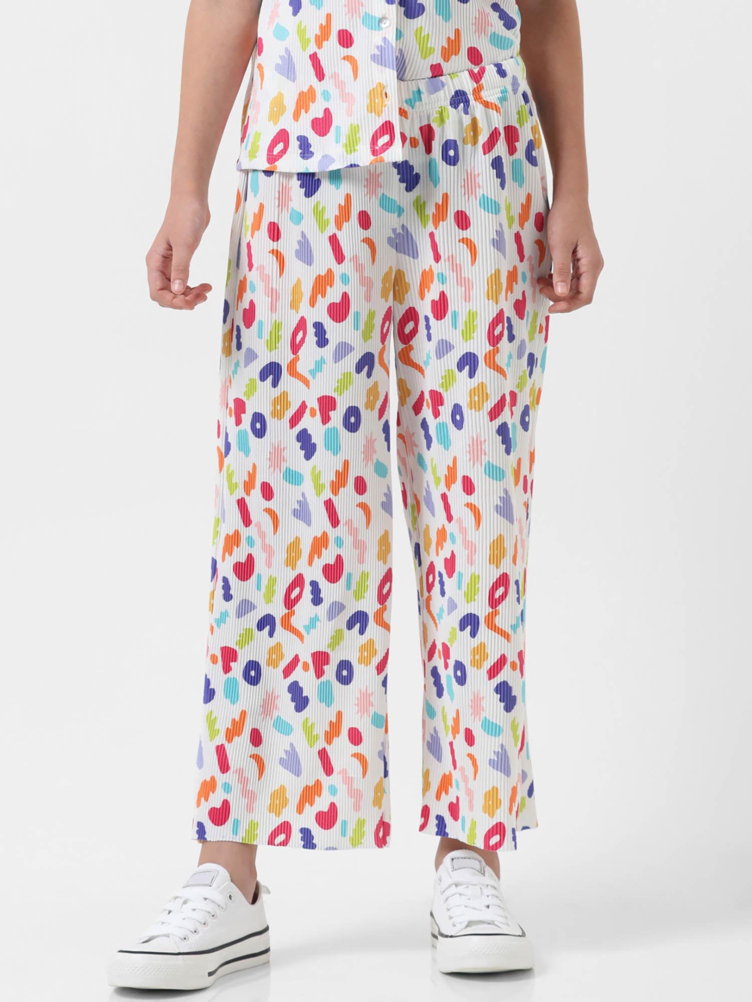 girl abstract print white trousers