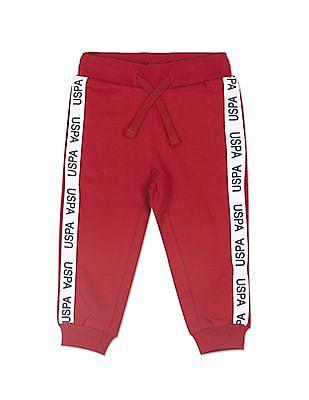girls red mid rise solid joggers