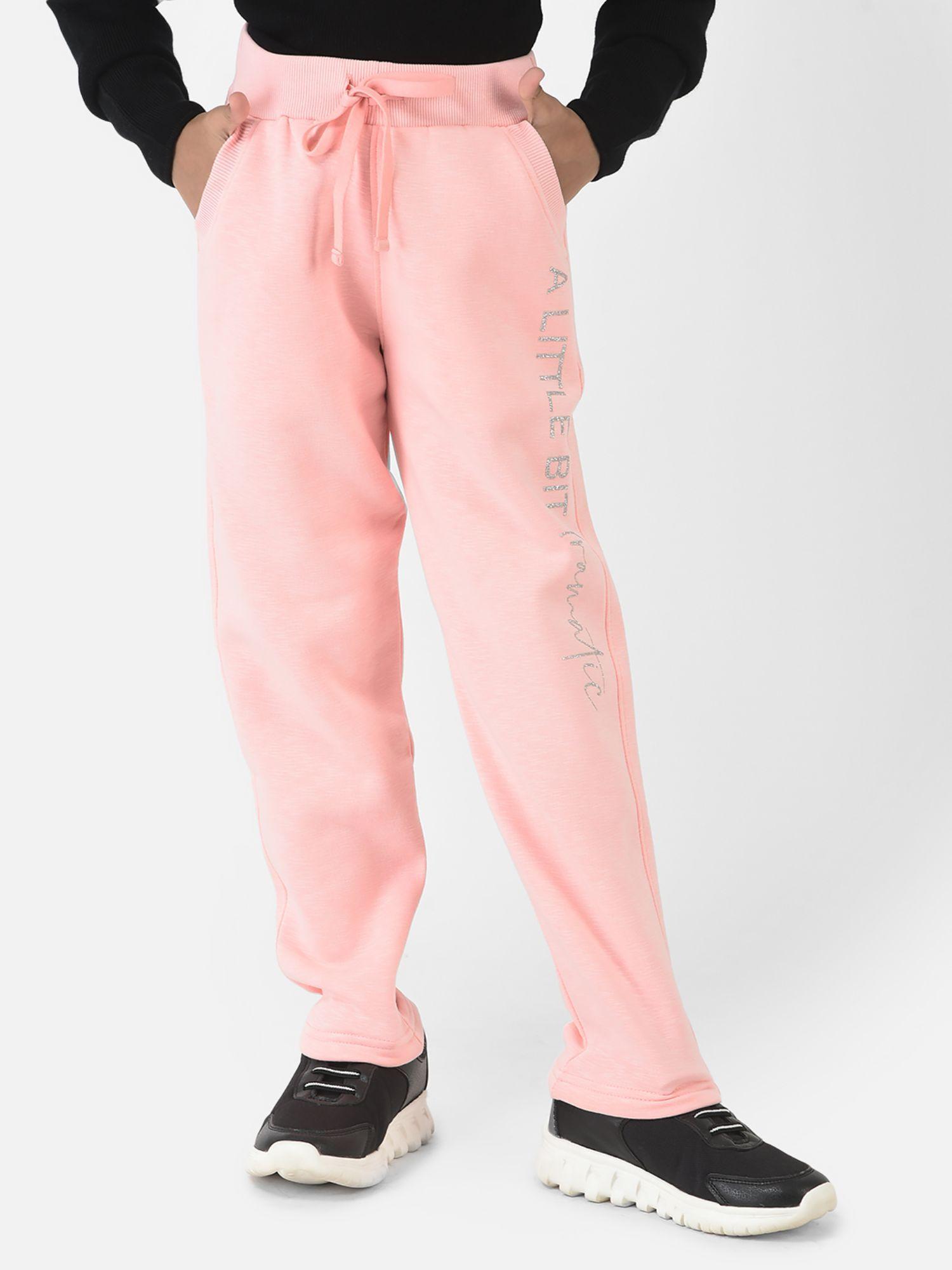 girls baby pink track pants with typographic detailing