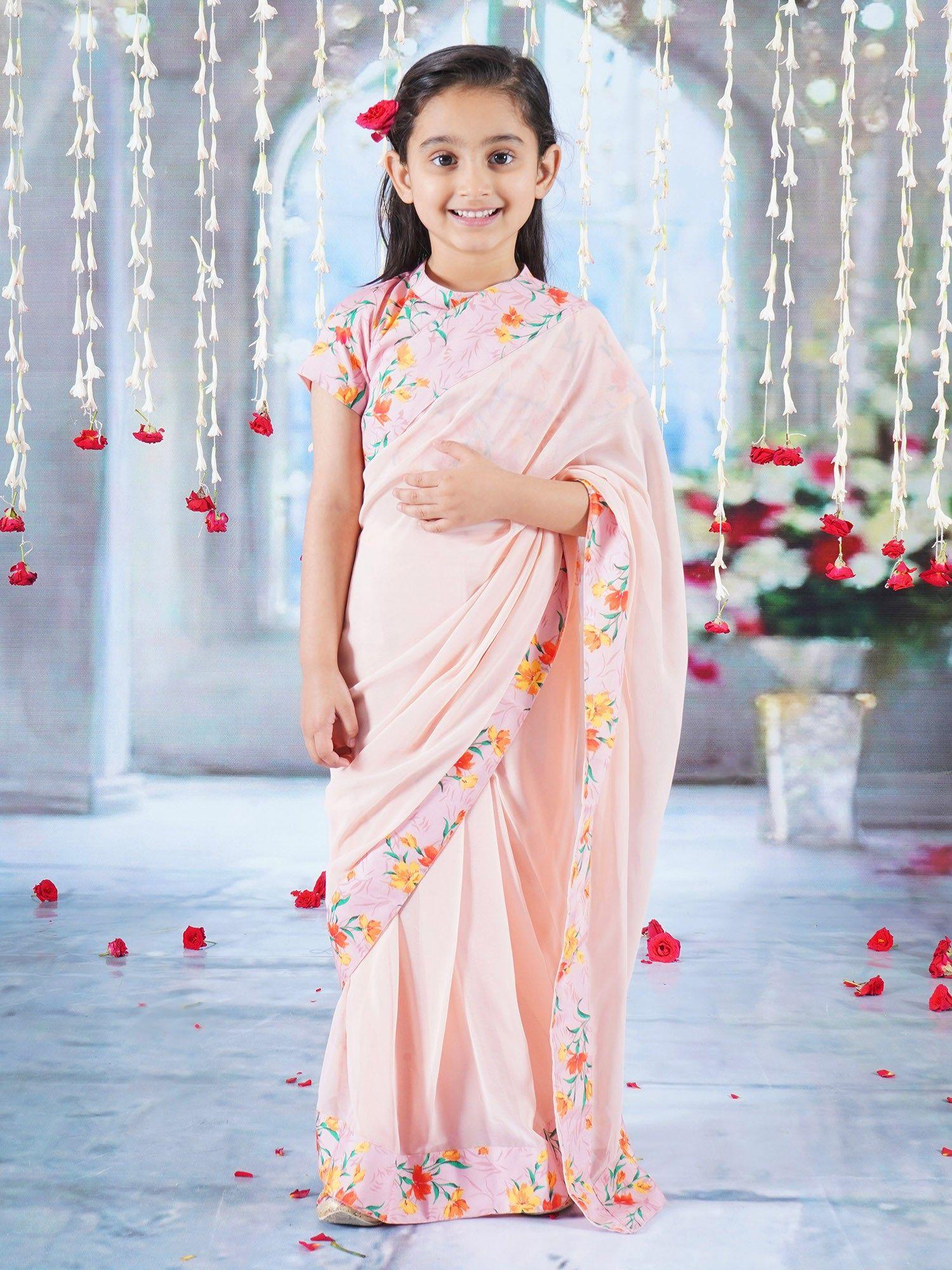 girls peach short sleeves floral georgette saree with stitched blouse