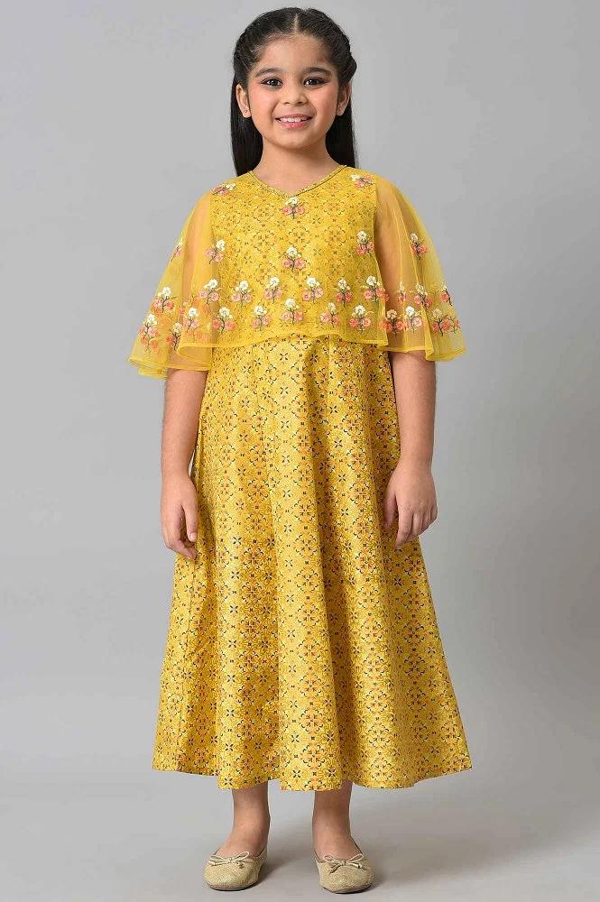 girls yellow dress with net layered cape