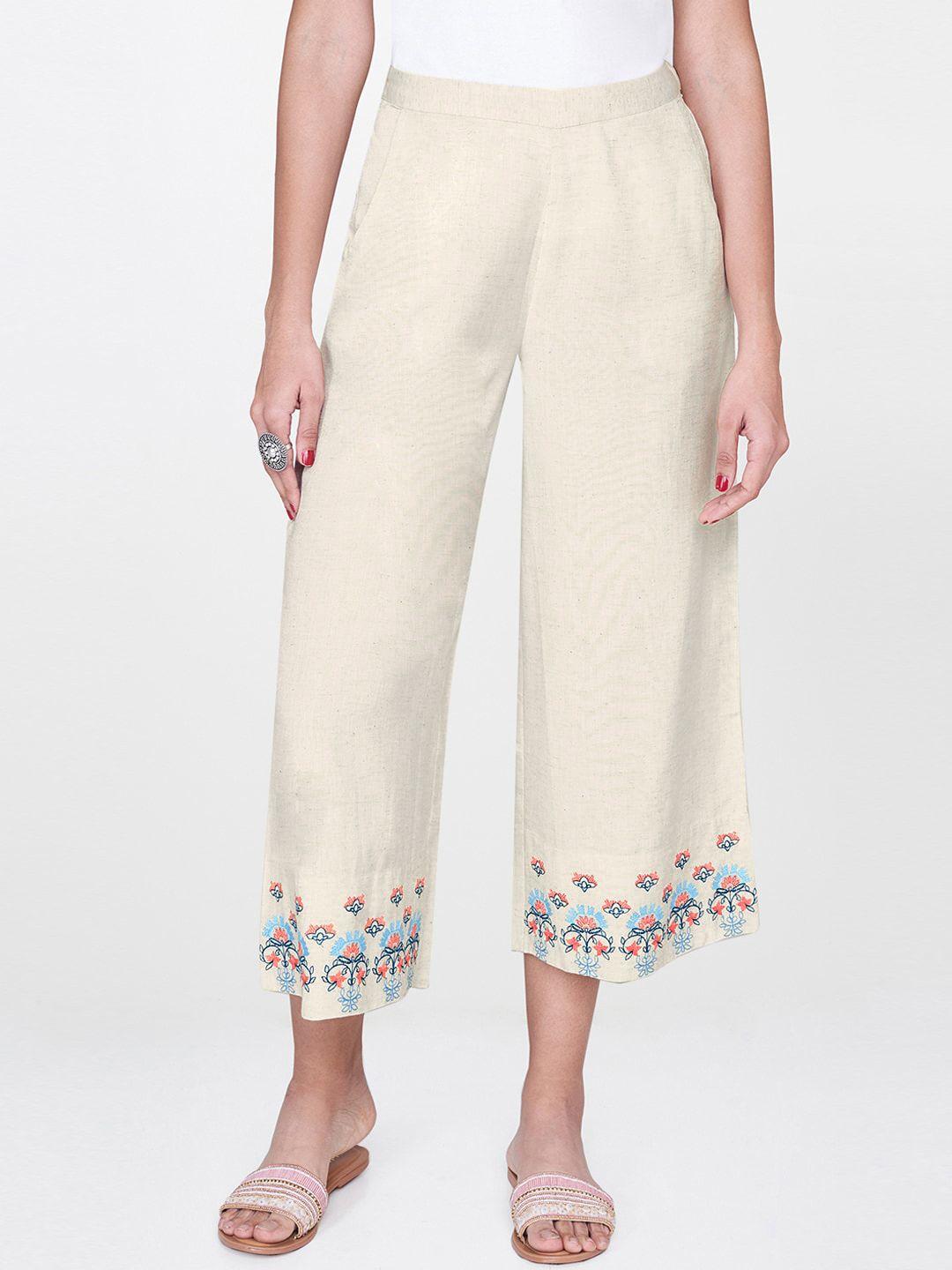 global desi women off-white straight fit solid parallel trousers with printed detail