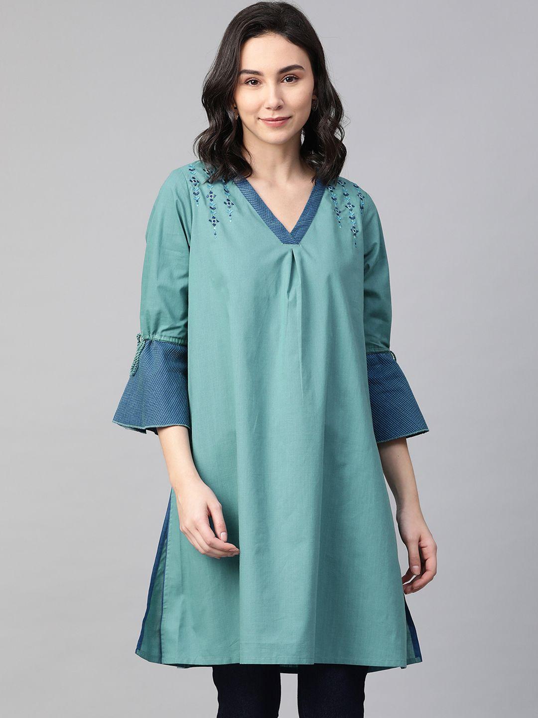 global desi women's green solid pure cotton tunic