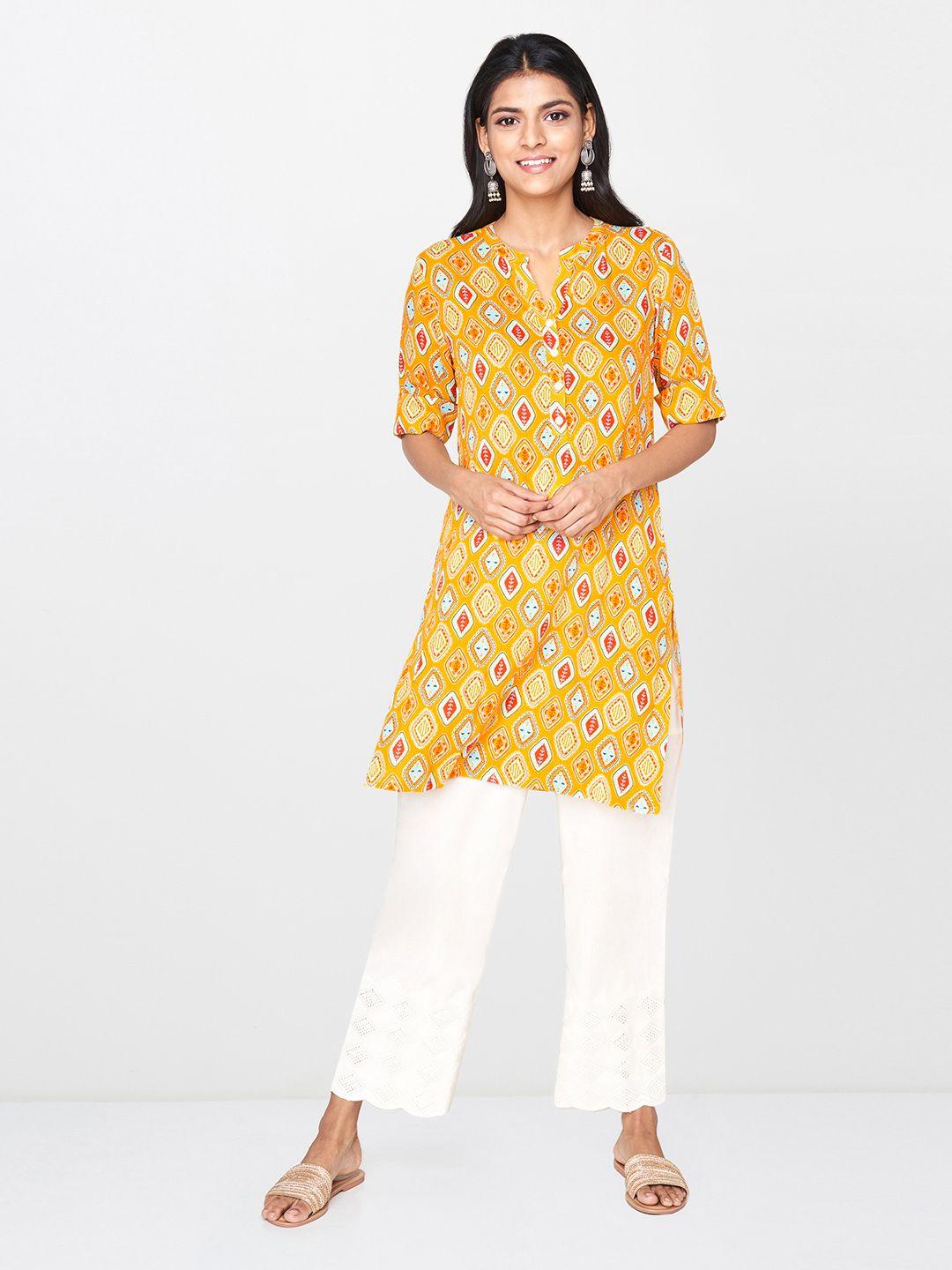 global desi women's mustard yellow & red printed tunic