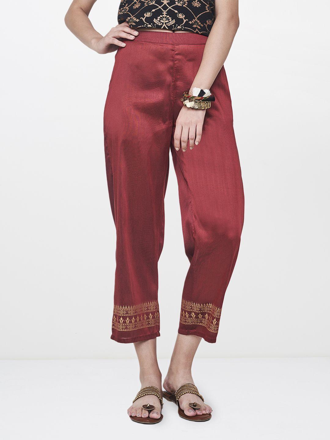 global desi women maroon regular fit printed regular trousers