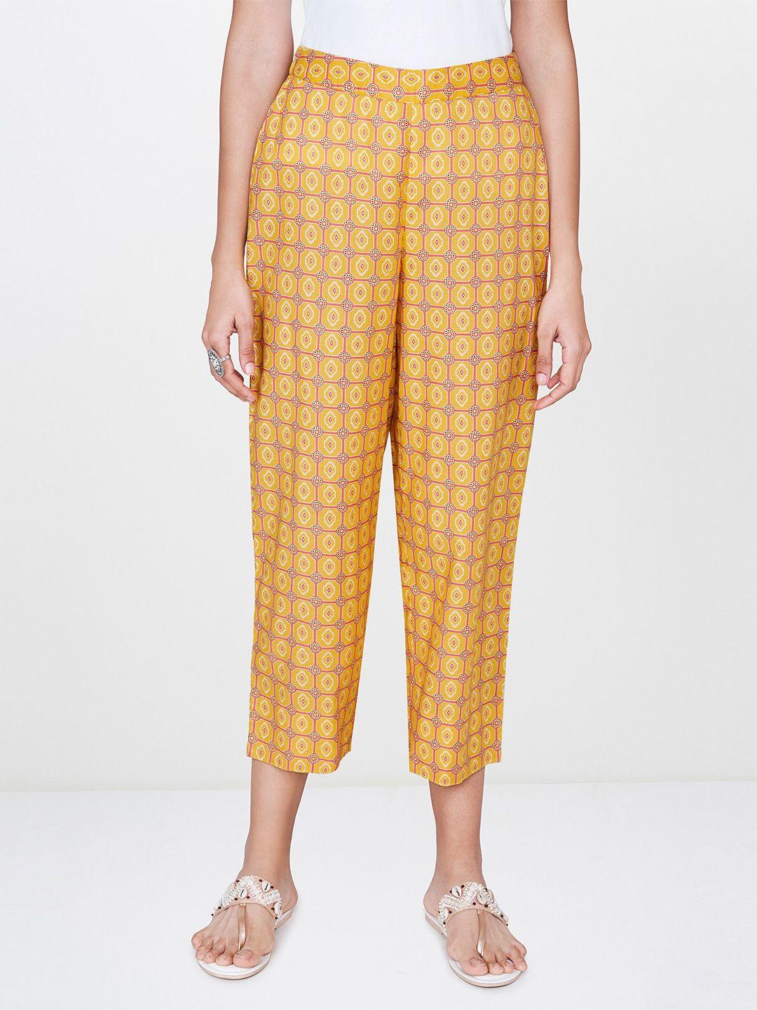 global desi women mustard yellow & pink straight fit printed cropped regular trousers