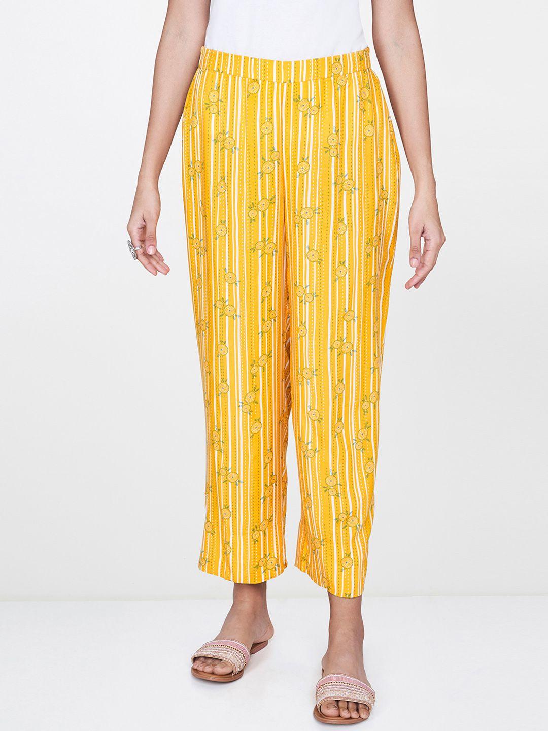 global desi women mustard yellow & white relaxed straight fit printed regular trousers