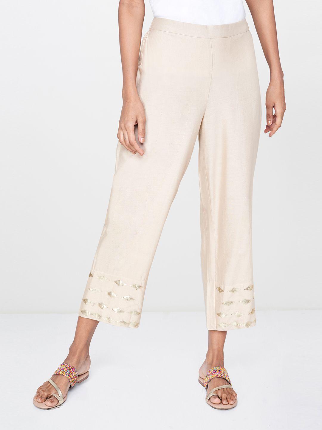 global desi women off-white relaxed straight fit solid parallel trousers