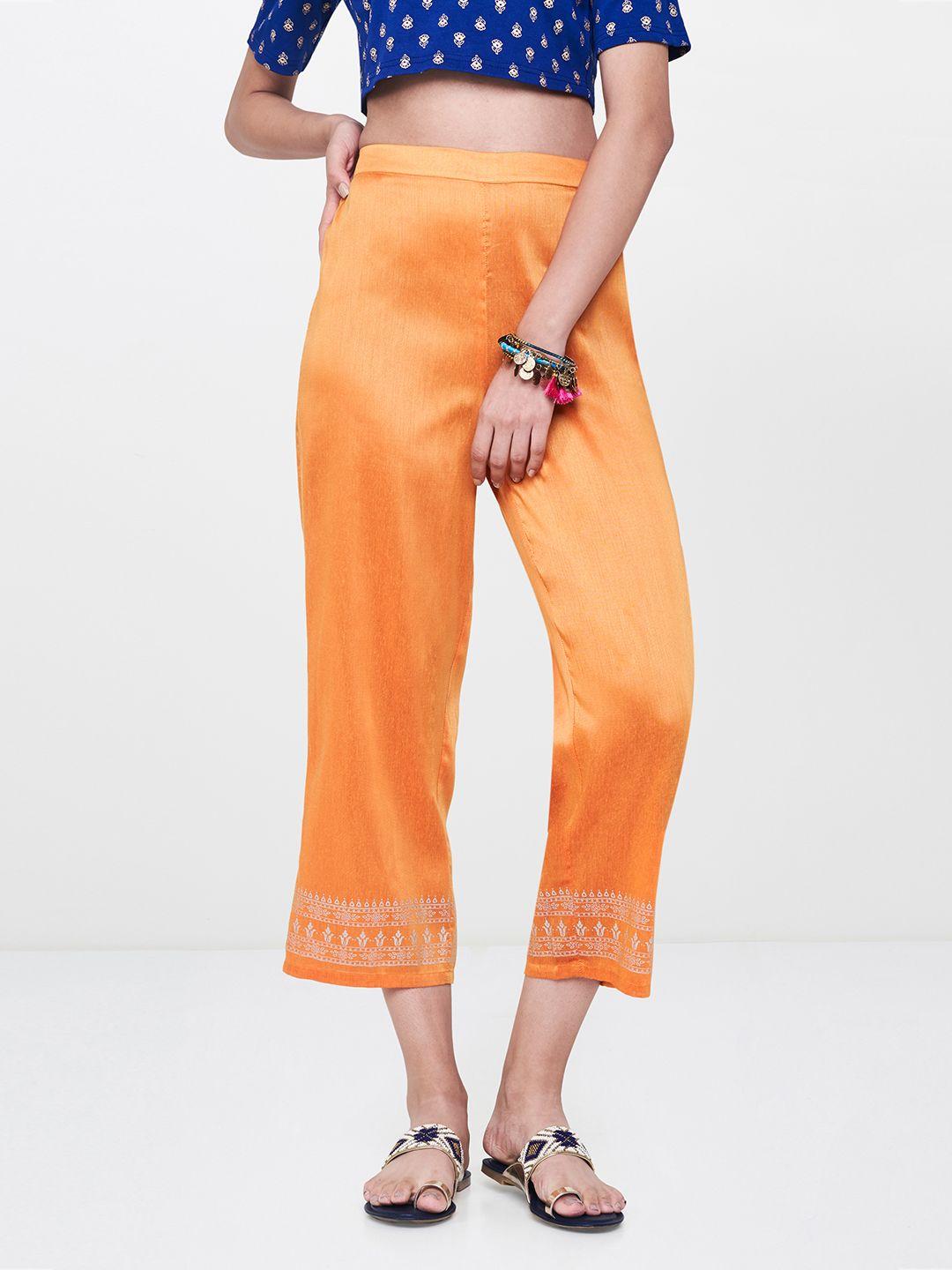 global desi women orange regular fit printed regular trousers