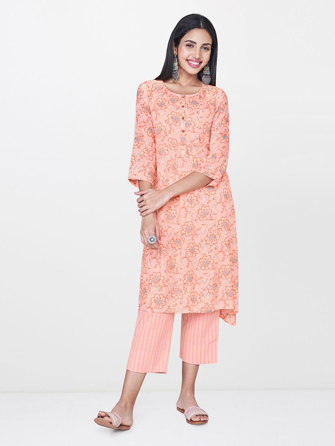 global desi women peach-coloured & blue printed asymmetric hemline a-line kurta