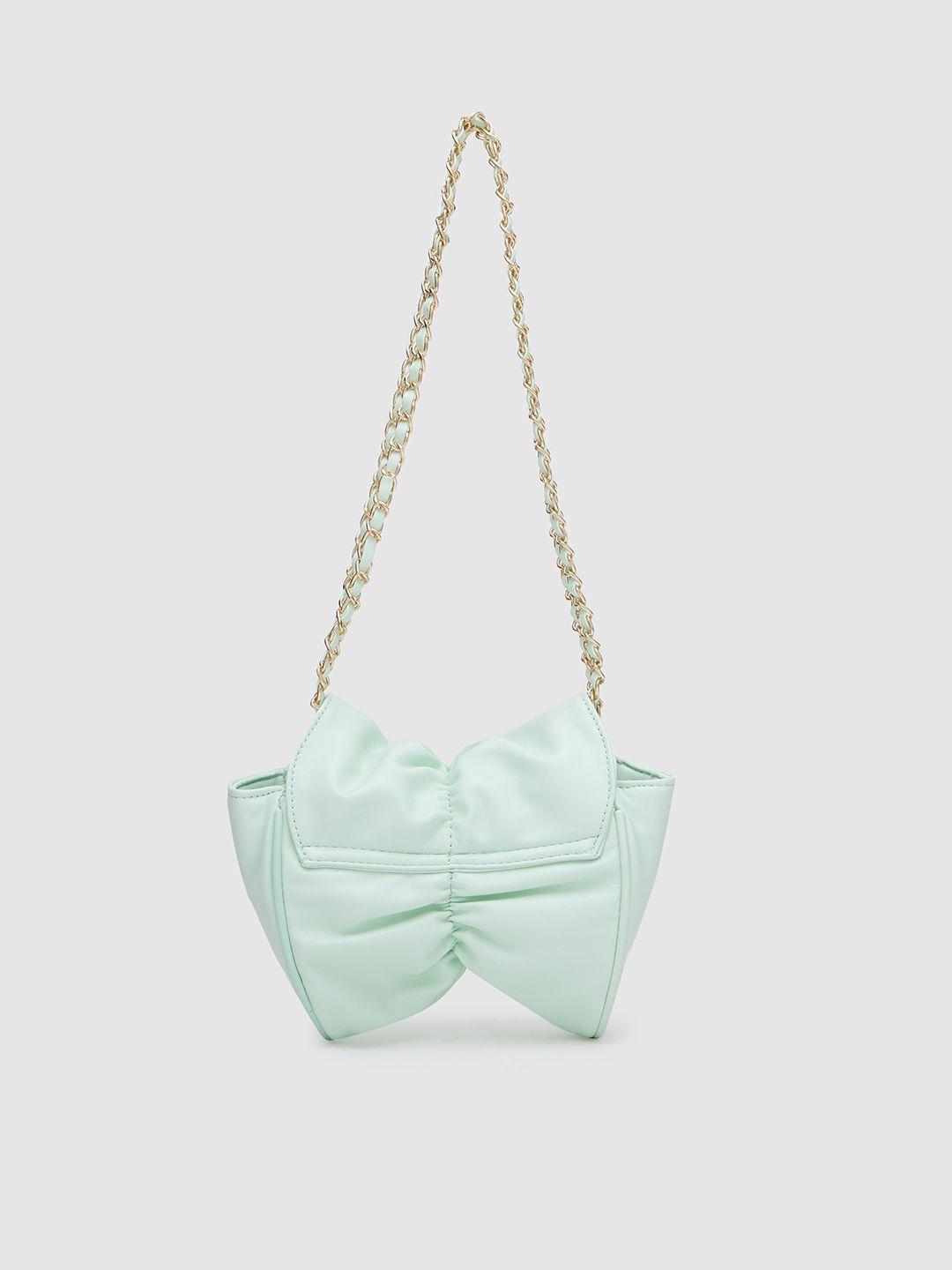 globus mint green sling bag with bow detail