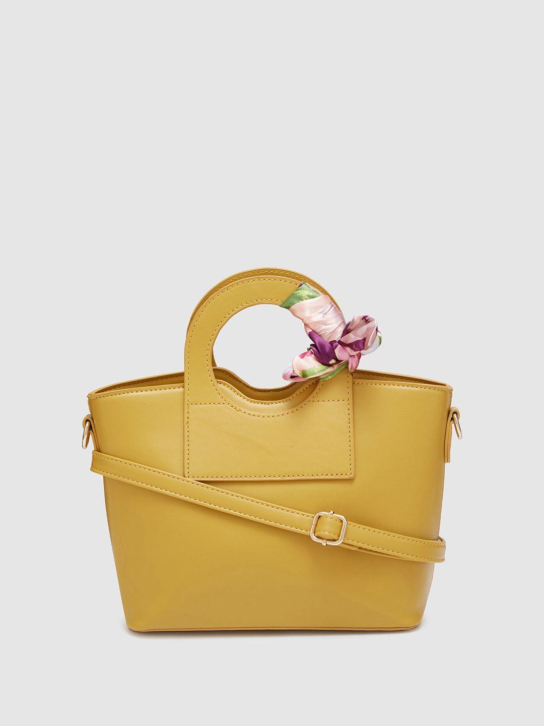 globus mustard structured handheld bag