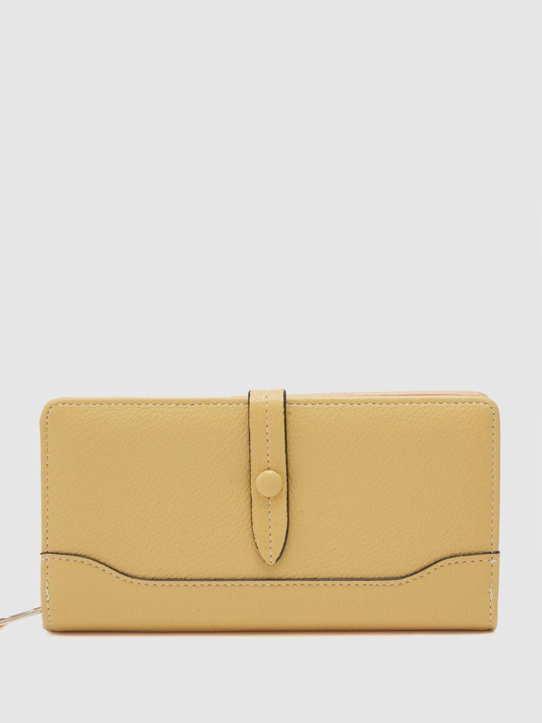 globus women mustard textured zip around wallet