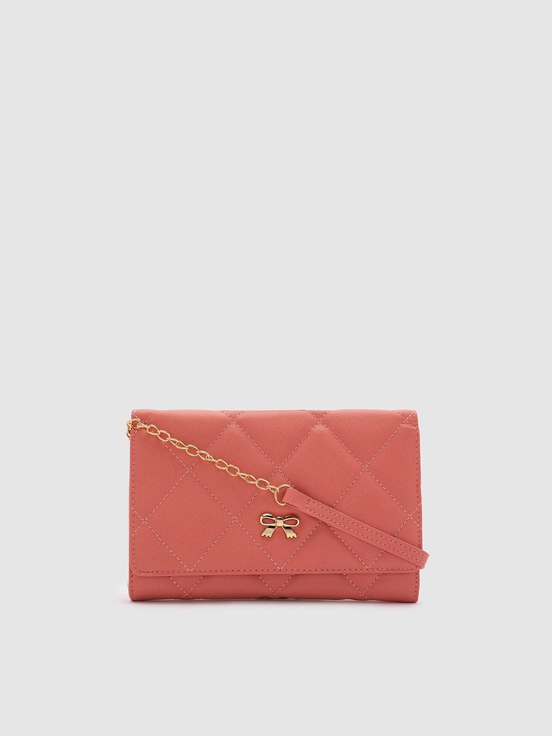 globus women red & gold-toned geometric textured bow detail pu envelope wallet