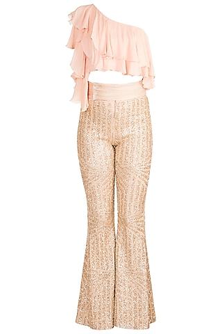 gold sequins pants with blush pink one shoulder top