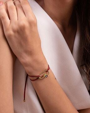 gold-plated evil eye link bracelet