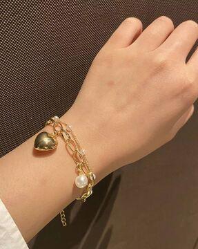 gold-plated link braclet with heart charms
