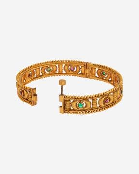 gold-plated stone-studded broad bangles with lobster claw closure
