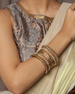 gold-plated stone-studded broad bangles
