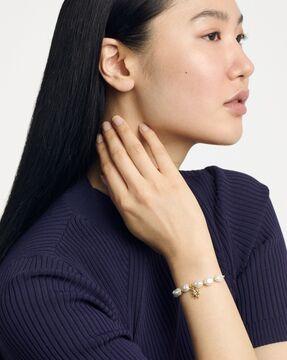 gold-plated american diamond-studded charm beaded stretch bracelet