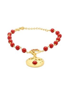 gold-plated beaded bracelet with charm