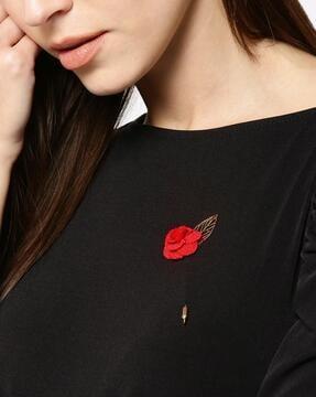 gold-plated floral lapel pin